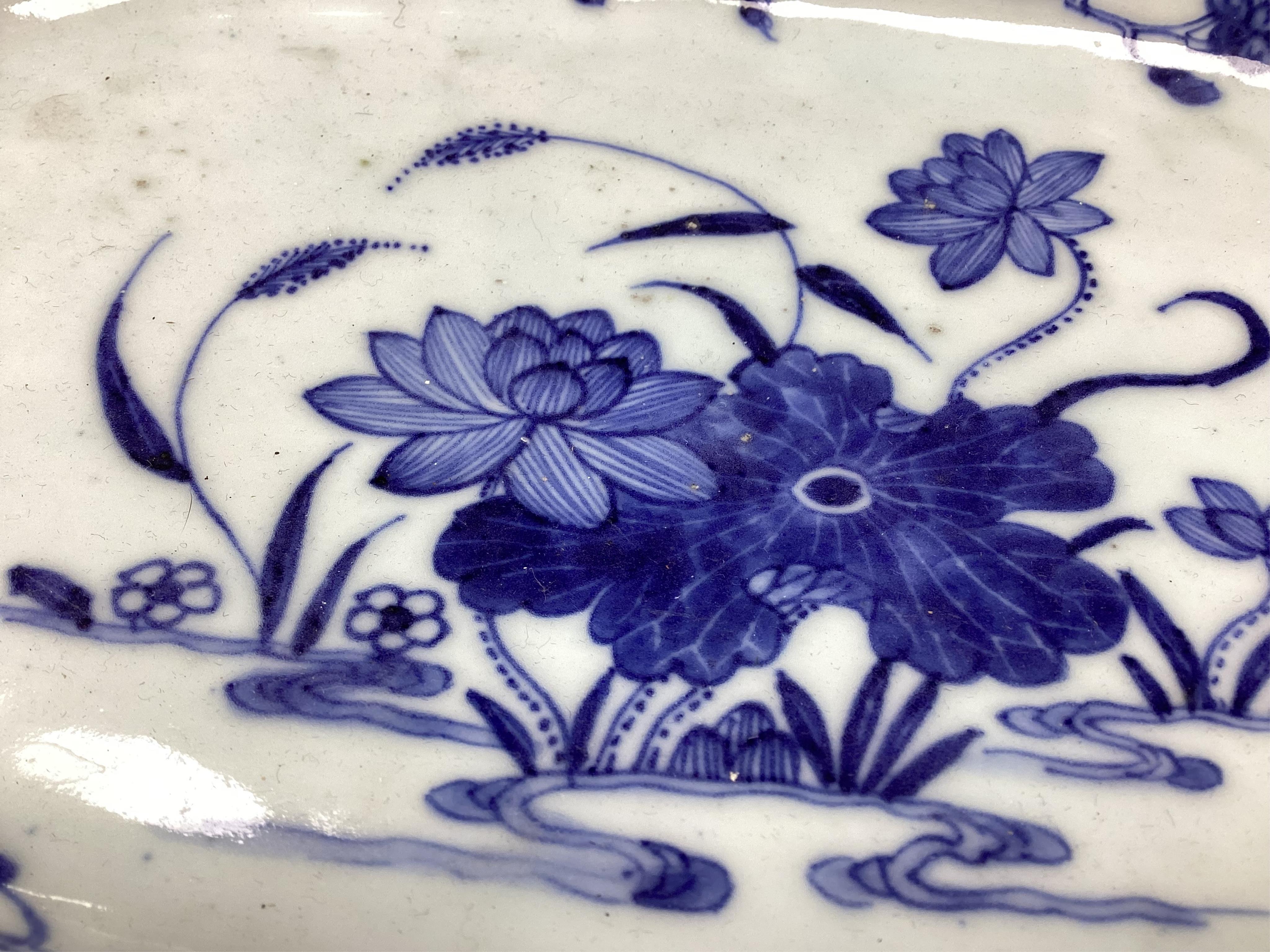 An 18th century Chinese Export serving dish and (repaired) plate, largest 32cm. Condition - poor